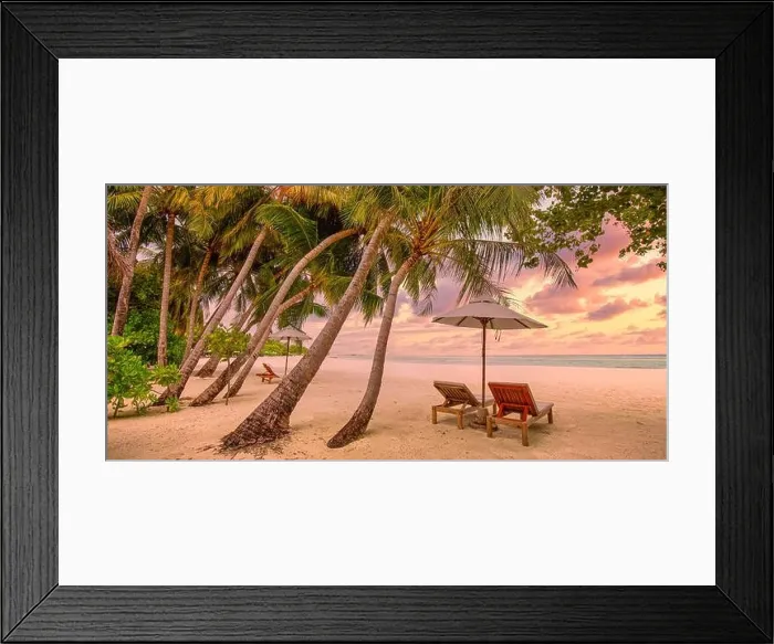 Framed Print : Tranquil tropical sunset scenery couple sun bed loungers, umbrella palm tree leaves. White sand sea view horizon, colorful twilight sky, calm relax Framed Print : Tranquil tropical sunset scenery couple sun bed loungers, umbrella palm tree leaves. White sand sea view horizon, colorful twilight sky, calm relax