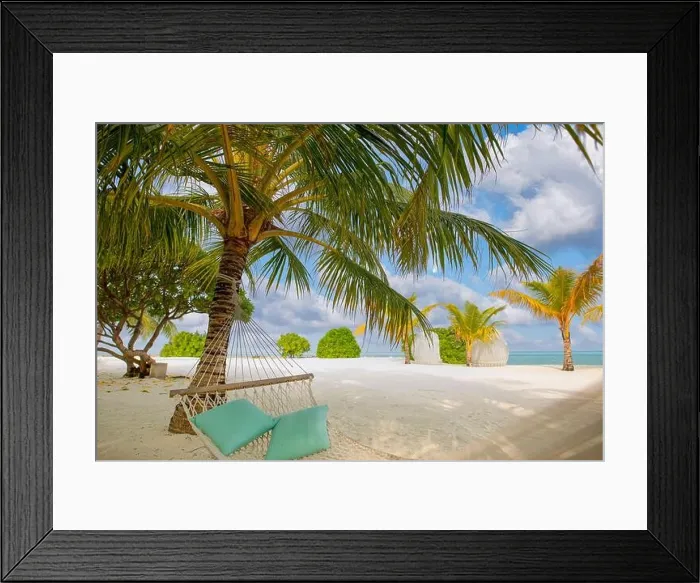Framed Print : Sunny island beach with palm trees and traditional braided hammock with pillows. Romantic couple summer destination. Paradise landscape. Relax idyllic Framed Print : Sunny island beach with palm trees and traditional braided hammock with pillows. Romantic couple summer destination. Paradise landscape. Relax idyllic
