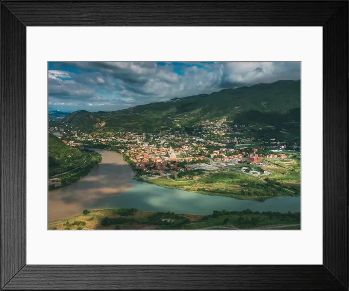 Framed Print : Mtskheta Georgia. Aerial View Of Picturesque Highlands With Blue Sky Over Ancient Town In Green Valley Of Confluence Of Two Rivers Framed Print : Mtskheta Georgia. Aerial View Of Picturesque Highlands With Blue Sky Over Ancient Town In Green Valley Of Confluence Of Two Rivers