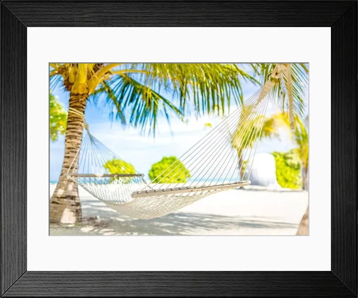 Framed Print : Hammock between two coconut trees on a tropical island with beautiful beach. Blurred tropical landscape Framed Print : Hammock between two coconut trees on a tropical island with beautiful beach. Blurred tropical landscape