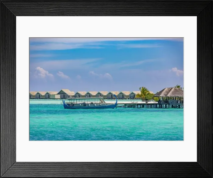 Framed Print : Maldivian water bungalows. Luxury travel background, exotic over water villas, wooden boat Dhoni. Summer travel destination Framed Print : Maldivian water bungalows. Luxury travel background, exotic over water villas, wooden boat Dhoni. Summer travel destination