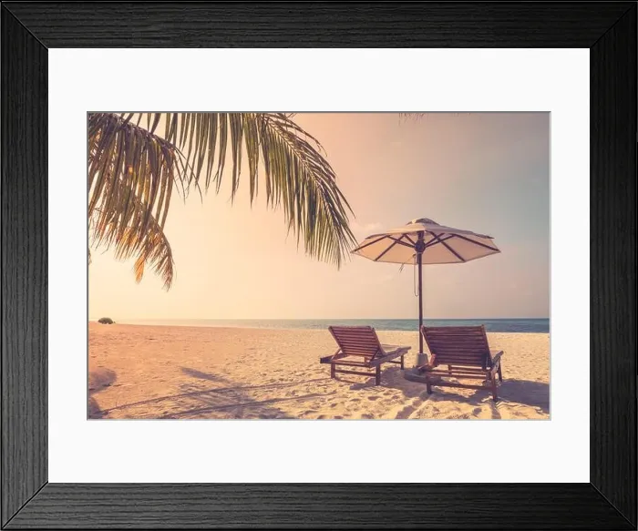 Framed Print : Beautiful tropical sunset scenery, two sun beds loungers umbrella palm tree. White sand, sea view with horizon, colorful twilight sky, beach resort Framed Print : Beautiful tropical sunset scenery, two sun beds loungers umbrella palm tree. White sand, sea view with horizon, colorful twilight sky, beach resort