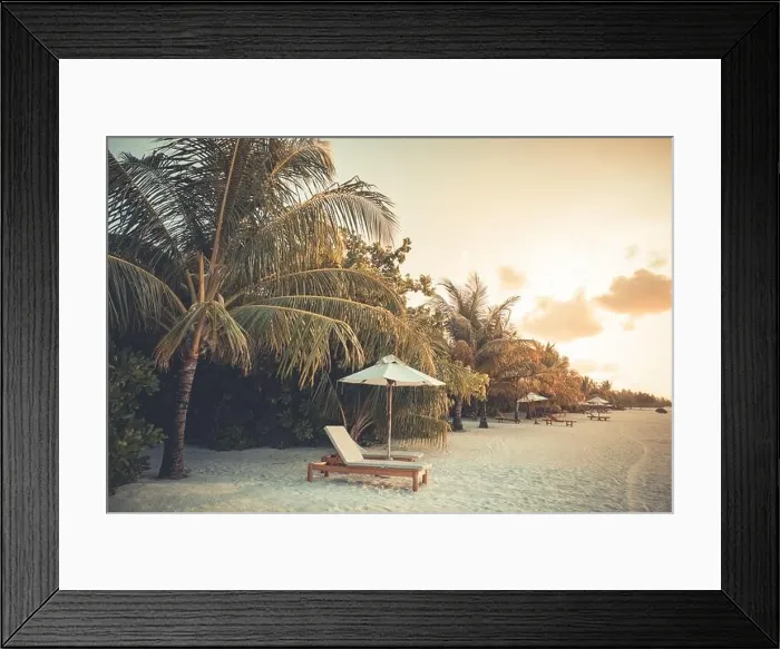 Framed Print : Beautiful tropical sunset scenery, two sun beds loungers umbrella palm tree. White sand, sea view with horizon, colorful twilight sky, beach resort Framed Print : Beautiful tropical sunset scenery, two sun beds loungers umbrella palm tree. White sand, sea view with horizon, colorful twilight sky, beach resort