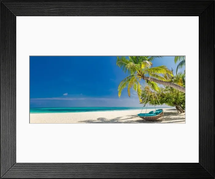 Framed Print : Tropical beach panorama as summer landscape with beach swing or hammock and white sand and calm sea for beach banner. Perfect beach scene vacation Framed Print : Tropical beach panorama as summer landscape with beach swing or hammock and white sand and calm sea for beach banner. Perfect beach scene vacation