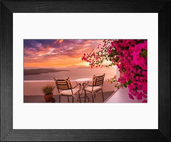 Framed Print : Summer sunset vacation scenic of luxury famous Europe destination. White architecture in Santorini, Greece. Stunning travel scenery with pink flowers Framed Print : Summer sunset vacation scenic of luxury famous Europe destination. White architecture in Santorini, Greece. Stunning travel scenery with pink flowers