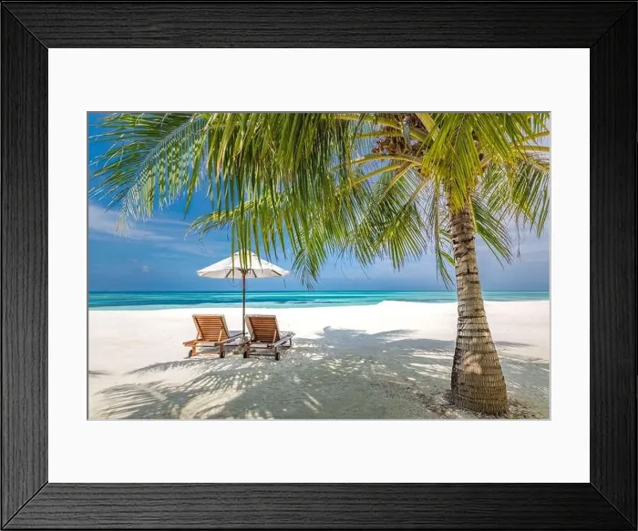 Framed Print : Romantic beach honeymoon destination for couples, beach chairs with palm leaves and umbrella, close to blue sea. Amazing summer vacation holiday view Framed Print : Romantic beach honeymoon destination for couples, beach chairs with palm leaves and umbrella, close to blue sea. Amazing summer vacation holiday view