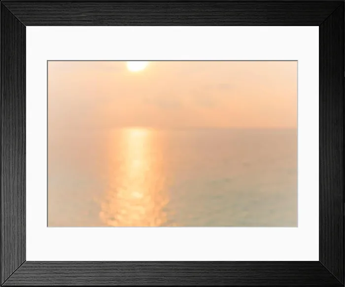 Framed Print : Blur sunset beach with bokeh sun light wave abstract background. Travel concept. Retro color style Framed Print : Blur sunset beach with bokeh sun light wave abstract background. Travel concept. Retro color style