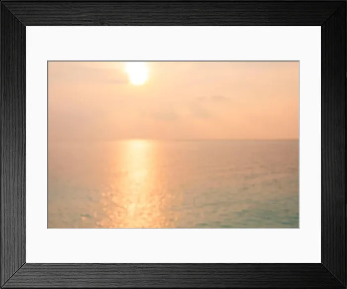 Framed Print : Blur sunset beach with bokeh sun light wave abstract background. Travel concept. Retro color style Framed Print : Blur sunset beach with bokeh sun light wave abstract background. Travel concept. Retro color style