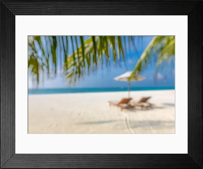 Framed Print : Summer exotic sandy beach with blur palms and sea on background. Blurry beach landscape, chairs and umbrella under palm leaves Framed Print : Summer exotic sandy beach with blur palms and sea on background. Blurry beach landscape, chairs and umbrella under palm leaves