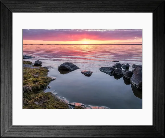 Framed Print : Scenic sunset with peaceful lake and rock at spring evening in Finland Framed Print : Scenic sunset with peaceful lake and rock at spring evening in Finland