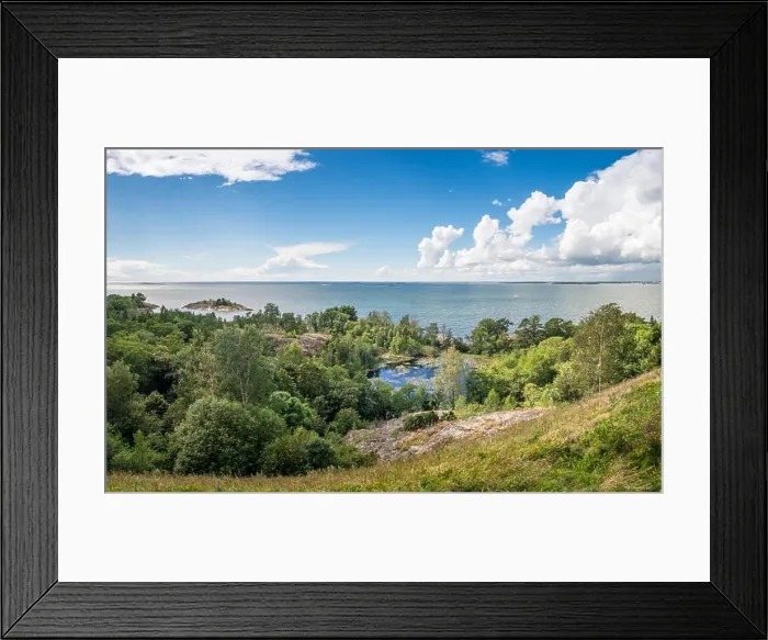 Framed Print : Scenic landscape with sea and lush foliage at bright summer day in Finland Framed Print : Scenic landscape with sea and lush foliage at bright summer day in Finland