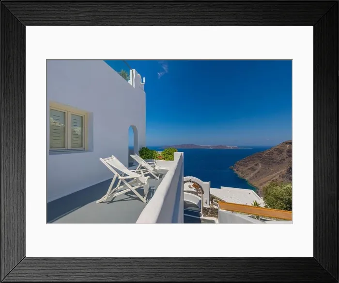 Framed Print : Beautiful panoramic street view on the mediterranean blue sea, caldera and volcano. Traditional white architecture of Santorini island, Thira, Greece Framed Print : Beautiful panoramic street view on the mediterranean blue sea, caldera and volcano. Traditional white architecture of Santorini island, Thira, Greece