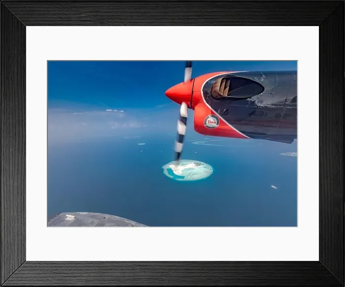Framed Print : Maldives beach from birds eye view. Aerial view on Maldives island. Tropical islands and atolls in Maldives from aerial view. Summer holiday Framed Print : Maldives beach from birds eye view. Aerial view on Maldives island. Tropical islands and atolls in Maldives from aerial view. Summer holiday