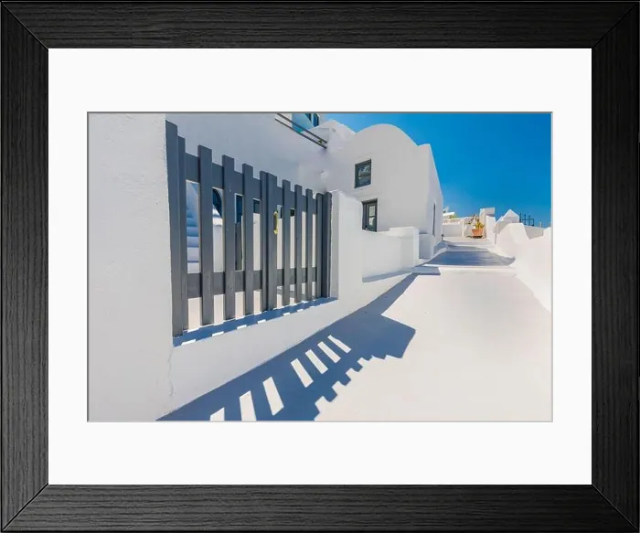 Framed Print : Beautiful panoramic street view on the mediterranean blue sea, caldera and volcano. Traditional white architecture of Santorini island, Thira, Greece Framed Print : Beautiful panoramic street view on the mediterranean blue sea, caldera and volcano. Traditional white architecture of Santorini island, Thira, Greece