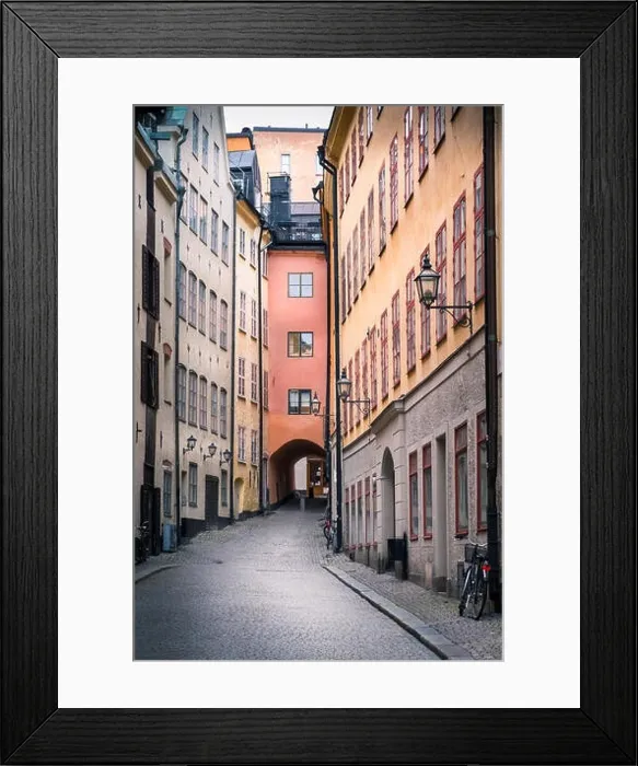Framed Print : STOCKHOLM, SWEDEN - October 14, 2016: View from narrow and idyllic street with colorful buildings in Gamla Stan. The Old Town in Stockholm, Sweden. Cl