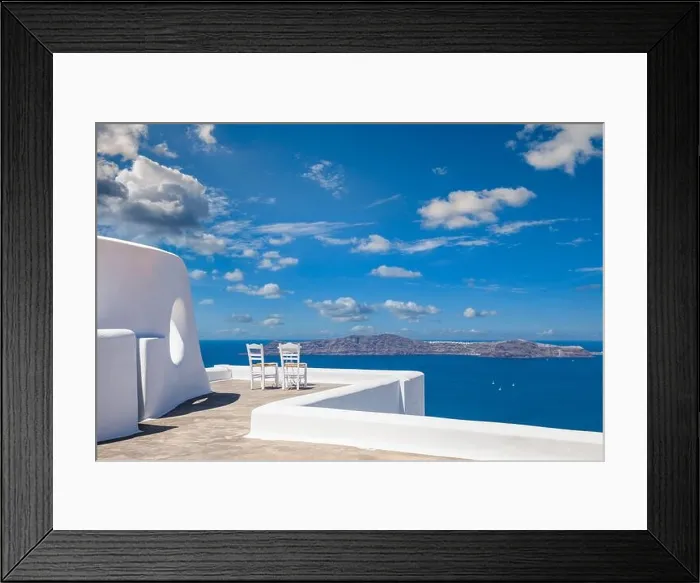 Framed Print : Santorini island caldera view with chairs and white architecture, romantic mood, couple travel vacation landscape destination scenic. Tourism view Framed Print : Santorini island caldera view with chairs and white architecture, romantic mood, couple travel vacation landscape destination scenic. Tourism view