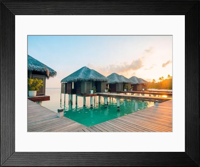 Framed Print : Sunset on Maldives island, luxury water villas resort and wooden pier. Beautiful sky clouds and beach background for summer vacation holiday travel Framed Print : Sunset on Maldives island, luxury water villas resort and wooden pier. Beautiful sky clouds and beach background for summer vacation holiday travel