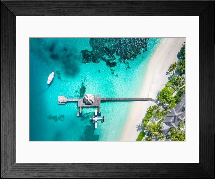 Framed Print : Atolls and islands in Maldives with jetty and over water villas. Luxury summer holiday vacation, white sand, blue sea, idyllic tropical island beach
