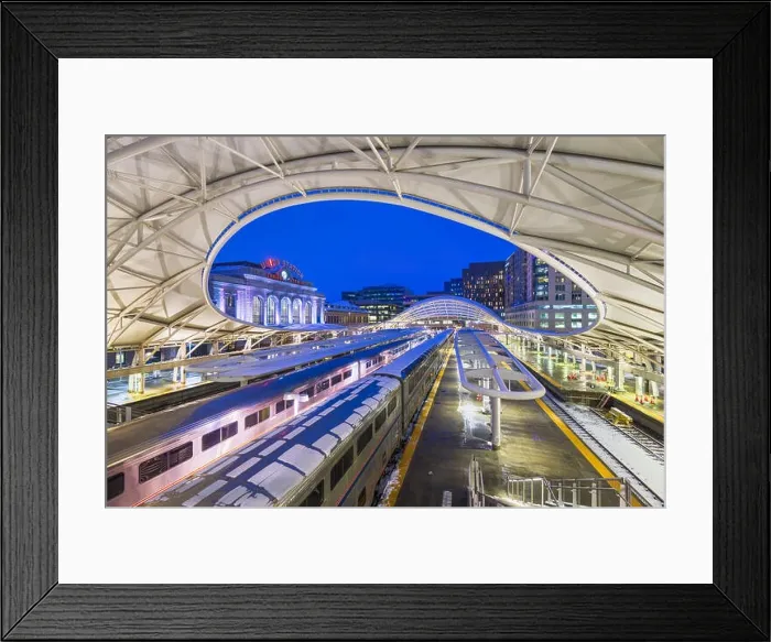 Framed Print : DENVER, COLORADO - MARCH 13, 2019: Trains out of service at Union Station after the Bomb Cyclone winter weather event. The central portion of the st Framed Print : DENVER, COLORADO - MARCH 13, 2019: Trains out of service at Union Station after the Bomb Cyclone winter weather event. The central portion of the st
