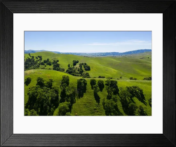 Framed Print : An aerial view of rolling hills in Northern California's tri-valley region shows lush, green grass that flourished after a wet winter Framed Print : An aerial view of rolling hills in Northern California's tri-valley region shows lush, green grass that flourished after a wet winter