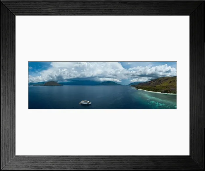 Framed Print : A large fringing reef grows along the edge of a remote island near Alor, Indonesia. This beautiful region is known for its high marine biodiversity