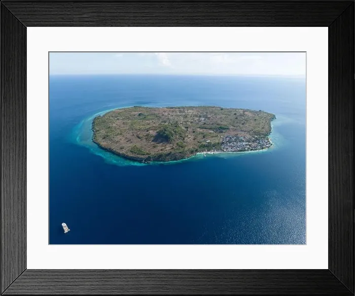 Framed Print : A fringing reef grows along the edge of a remote, tropical island near Alor, Indonesia. This region is known for its high marine biodiversity Framed Print : A fringing reef grows along the edge of a remote, tropical island near Alor, Indonesia. This region is known for its high marine biodiversity