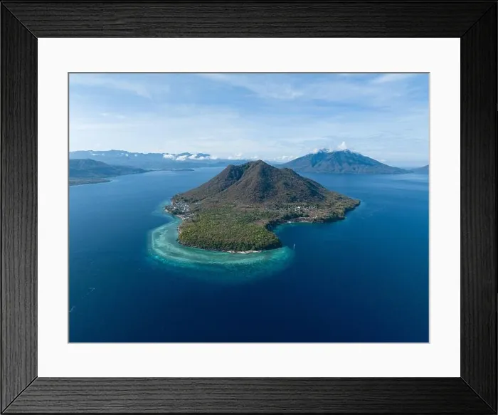 Framed Print : A fringing reef grows along the edge of a remote, volcanic island near Alor, Indonesia. This region is known for its high marine biodiversity Framed Print : A fringing reef grows along the edge of a remote, volcanic island near Alor, Indonesia. This region is known for its high marine biodiversity