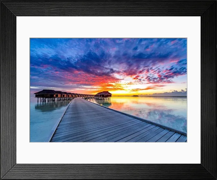 Framed Print : Colorful sunset over ocean on Maldives. Maldives island sunset. Water bungalows resort at islands beach. Indian Ocean, Maldives. Amazing travel scene Framed Print : Colorful sunset over ocean on Maldives. Maldives island sunset. Water bungalows resort at islands beach. Indian Ocean, Maldives. Amazing travel scene