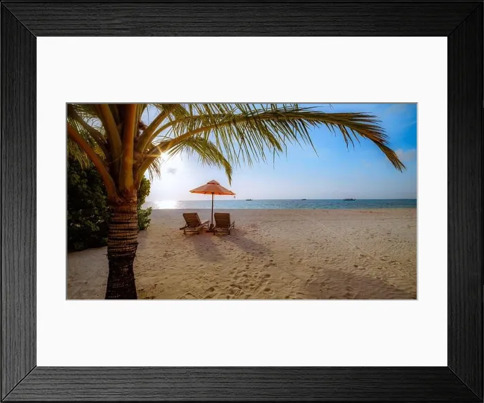 Framed Print : Beautiful tropical sunset scenery, two sun beds, loungers, umbrella under palm tree. White sand, sea view with horizon, colorful twilight sky, vibes Framed Print : Beautiful tropical sunset scenery, two sun beds, loungers, umbrella under palm tree. White sand, sea view with horizon, colorful twilight sky, vibes