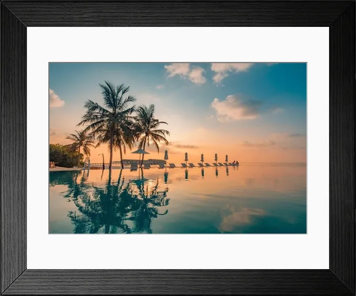 Framed Print : Luxury poolside on the beach with sunset colors. Amazing luxury summer background. Idyllic sunset beach scene, infinity pool in luxury resort, tropic