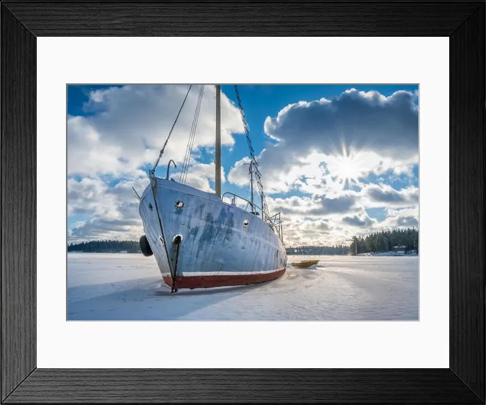 Framed Print : Old and broken abandoned ship on ice at sunny winter day in coastline Finland Framed Print : Old and broken abandoned ship on ice at sunny winter day in coastline Finland