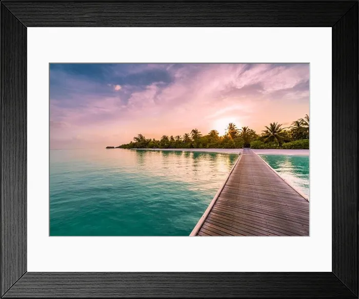 Framed Print : Sunset on Maldives island, luxury water villas resort and wooden pier, palm tree beautiful sky and clouds beach background for summer vacation holiday Framed Print : Sunset on Maldives island, luxury water villas resort and wooden pier, palm tree beautiful sky and clouds beach background for summer vacation holiday