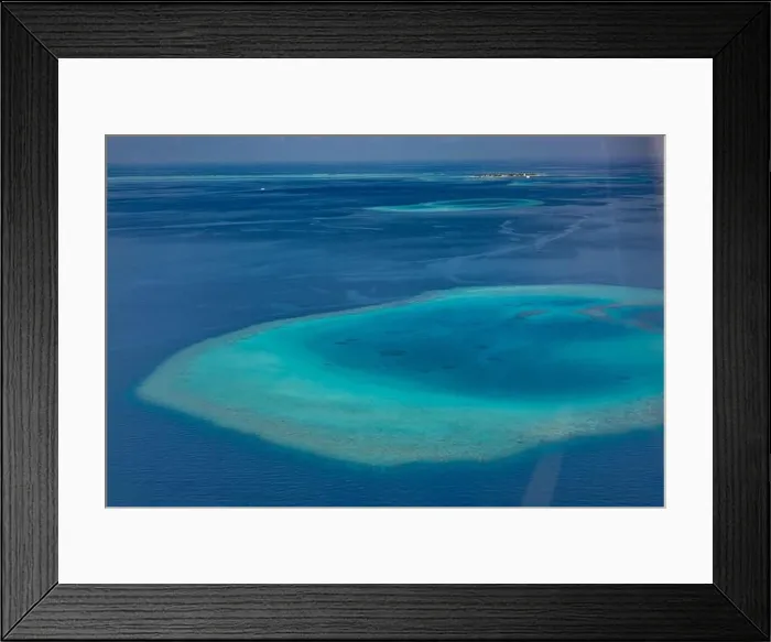 Framed Print : Aerial photo of beautiful paradise Maldives tropical lagoon with coral reef beach on island. Summer and travel vacation concept.View from seaplane Framed Print : Aerial photo of beautiful paradise Maldives tropical lagoon with coral reef beach on island. Summer and travel vacation concept.View from seaplane