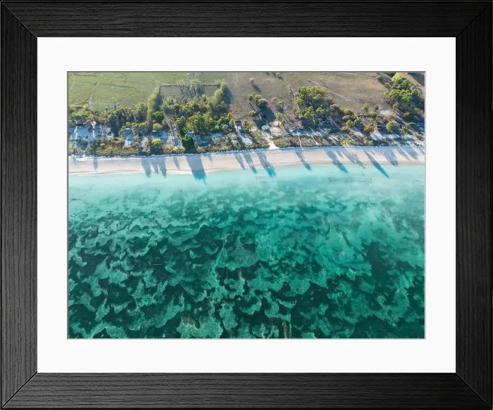 Framed Print : An expanse of sand and seagrass fringes a beautiful beach on the island of Pantar, Indonesia. This region is known for its high marine biodiversity Framed Print : An expanse of sand and seagrass fringes a beautiful beach on the island of Pantar, Indonesia. This region is known for its high marine biodiversity