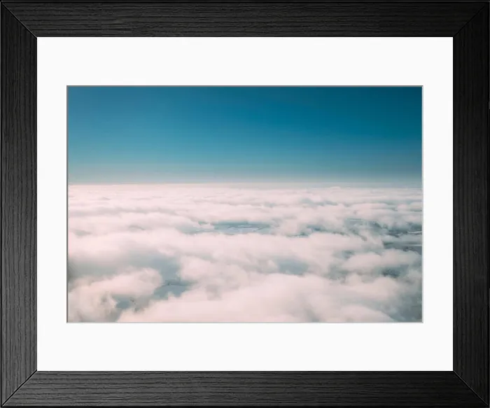 Framed Print : Beautiful Aerial View Of Sunny Clear Sky Over White Fluffy Clouds From Height Flight Of Plane. Bright White And Blue Colors Of Sunny Sky Framed Print : Beautiful Aerial View Of Sunny Clear Sky Over White Fluffy Clouds From Height Flight Of Plane. Bright White And Blue Colors Of Sunny Sky