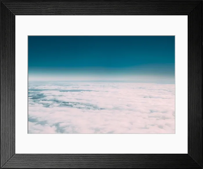 Framed Print : Beautiful Aerial View Of Sunny Clear Sky Over White Fluffy Clouds From Height Flight Of Plane. Bright White And Blue Colors Of Sunny Sky Framed Print : Beautiful Aerial View Of Sunny Clear Sky Over White Fluffy Clouds From Height Flight Of Plane. Bright White And Blue Colors Of Sunny Sky