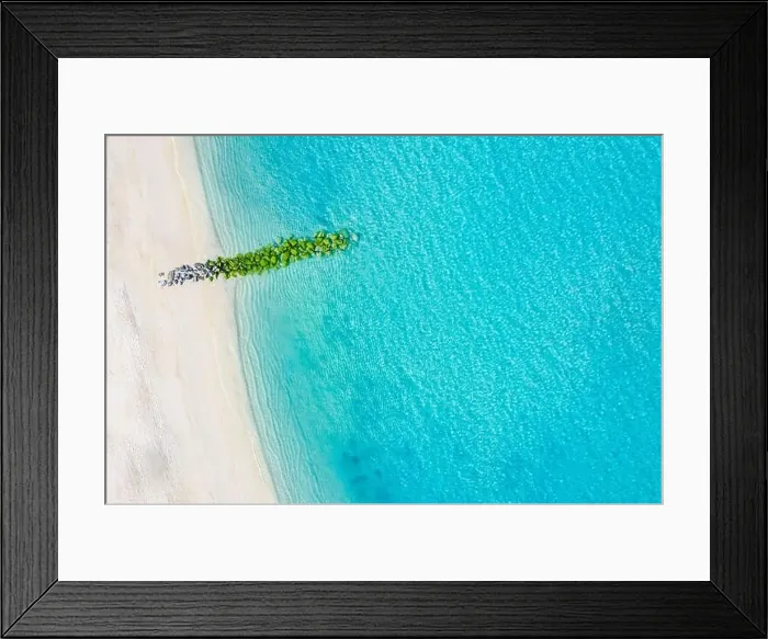 Framed Print : Sand beach aerial, top view of a beautiful sandy beach aerial shot with the blue waves rolling into the shore, some rocks present Framed Print : Sand beach aerial, top view of a beautiful sandy beach aerial shot with the blue waves rolling into the shore, some rocks present