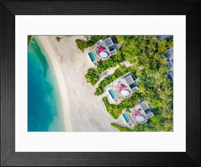 Framed Print : Aerial view of beach luxury villas of Indian Ocean. Summer holiday tropical landscape with palm trees, parasols white sand blue water, travel vacation Framed Print : Aerial view of beach luxury villas of Indian Ocean. Summer holiday tropical landscape with palm trees, parasols white sand blue water, travel vacation