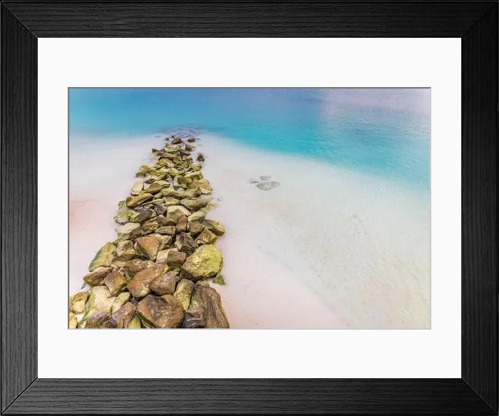 Framed Print : Rocks, sea and blue sky reflection on calm sea Framed Print : Rocks, sea and blue sky reflection on calm sea