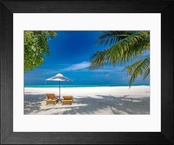 Framed Print : Paradise beach. Perfect tropical island. Beautiful palm trees and tropical beach nature. Moody blue sky and blue lagoon. Luxury travel summer holiday Framed Print : Paradise beach. Perfect tropical island. Beautiful palm trees and tropical beach nature. Moody blue sky and blue lagoon. Luxury travel summer holiday