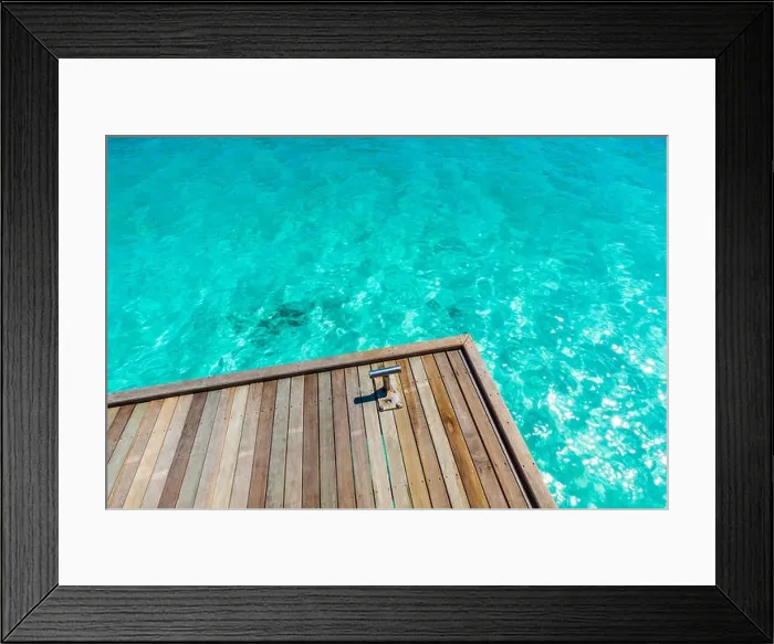 Framed Print : Wooden pier with blue sea and sky background. Tropical blue sea in sunlight. Inspirational sea view concept Framed Print : Wooden pier with blue sea and sky background. Tropical blue sea in sunlight. Inspirational sea view concept