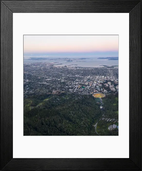 Framed Print : A beautiful sunrise illuminates Oakland, Berkeley and San Francisco Bay in Northern California. This area is often covered by a thick marine layer Framed Print : A beautiful sunrise illuminates Oakland, Berkeley and San Francisco Bay in Northern California. This area is often covered by a thick marine layer