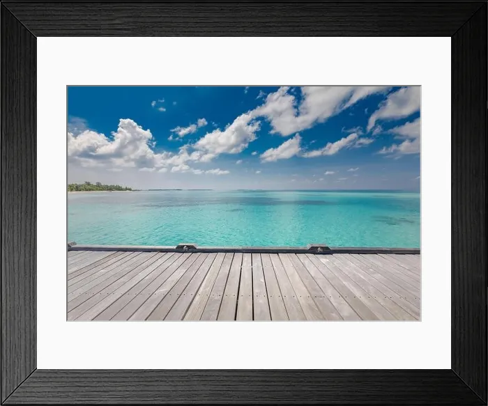 Framed Print : Wooden table top on blue sea and tropical island beach background. Luxury summer travel and vacation concept. Exotic holiday design Framed Print : Wooden table top on blue sea and tropical island beach background. Luxury summer travel and vacation concept. Exotic holiday design