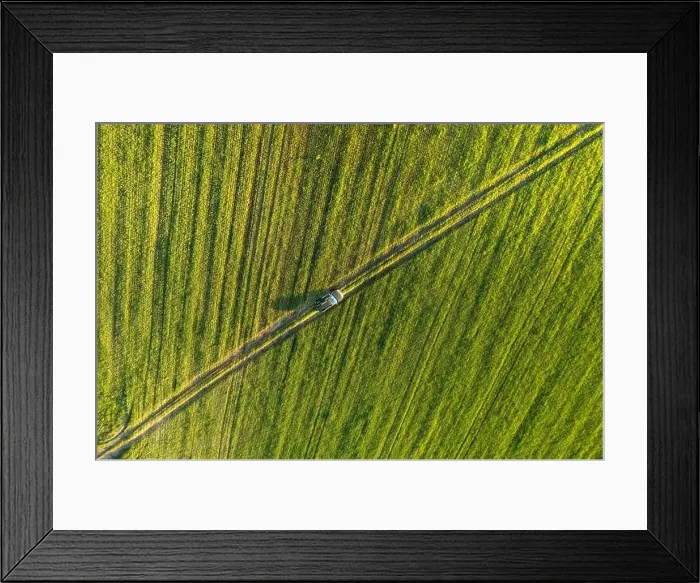 Framed Print : Aerial view of car SUV parked near countryside road in field rural landscape. Bird's-eye drone view of car SUV parked near countryside road in summer Framed Print : Aerial view of car SUV parked near countryside road in field rural landscape. Bird's-eye drone view of car SUV parked near countryside road in summer