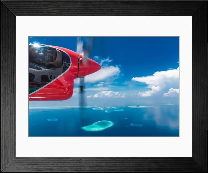 Framed Print : Aerial drone bird's eye view photo of Maldives island and sea. Beautiful turquoise and sapphire clear water beach. Exotic vacation from seaplane view Framed Print : Aerial drone bird's eye view photo of Maldives island and sea. Beautiful turquoise and sapphire clear water beach. Exotic vacation from seaplane view