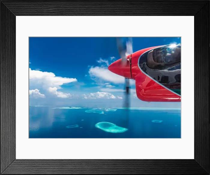Framed Print : Aerial drone bird's eye view photo of Maldives island and sea. Beautiful turquoise and sapphire clear water beach. Exotic vacation from seaplane view Framed Print : Aerial drone bird's eye view photo of Maldives island and sea. Beautiful turquoise and sapphire clear water beach. Exotic vacation from seaplane view