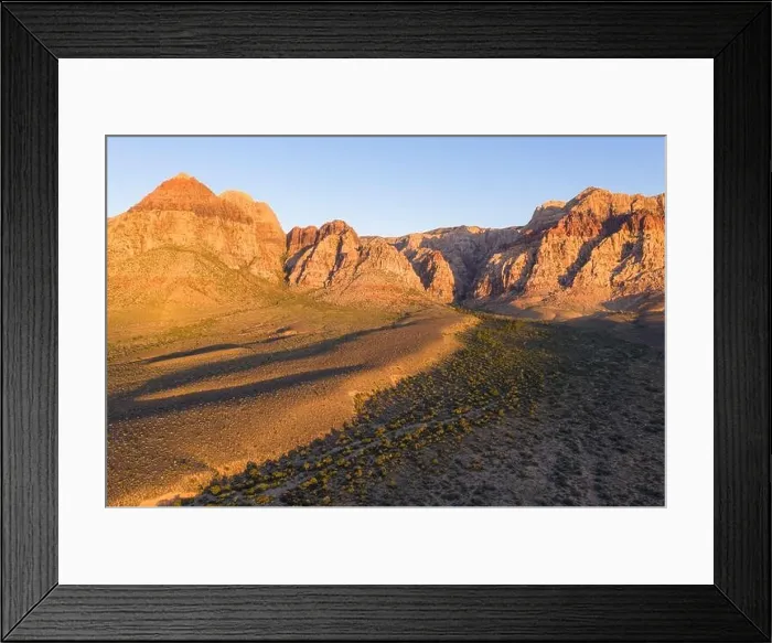 Framed Print : Early morning sunlight illuminates a beautiful mountain landscape that rises from the desert in Red Rock Canyon not far from Las Vegas, Nevada Framed Print : Early morning sunlight illuminates a beautiful mountain landscape that rises from the desert in Red Rock Canyon not far from Las Vegas, Nevada