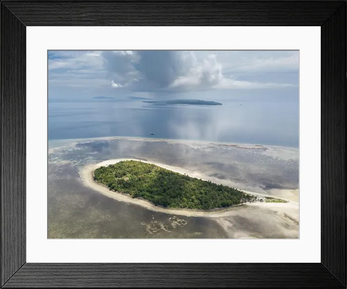 Framed Print : A gorgeous coral reef surrounds the remote island of Koon in the Banda Sea of Indonesia. This tropical region is known for its marine biodiversity Framed Print : A gorgeous coral reef surrounds the remote island of Koon in the Banda Sea of Indonesia. This tropical region is known for its marine biodiversity
