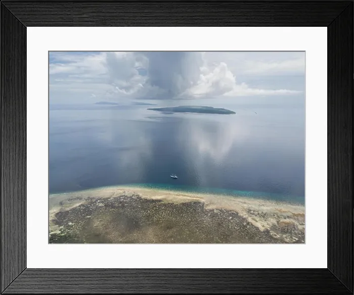 Framed Print : A gorgeous coral reef surrounds the remote island of Koon in the Banda Sea of Indonesia. This tropical region is known for its marine biodiversity Framed Print : A gorgeous coral reef surrounds the remote island of Koon in the Banda Sea of Indonesia. This tropical region is known for its marine biodiversity