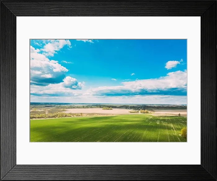 Framed Print : Aerial View. Sky With Clouds Above Countryside Rural Field Landscape In Spring Summer Cloudy Day. Scenic Sky With Fluffy Clouds On Horizon. Beauty In Framed Print : Aerial View. Sky With Clouds Above Countryside Rural Field Landscape In Spring Summer Cloudy Day. Scenic Sky With Fluffy Clouds On Horizon. Beauty In